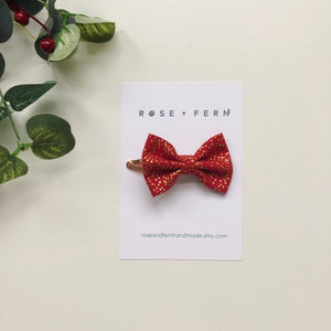 Handmade red and gold sparkle hair bow